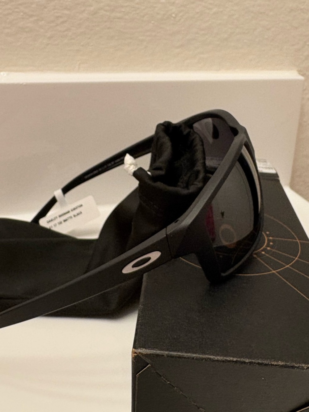 Oakley Black Frame Sunglasses with Dark Lenses